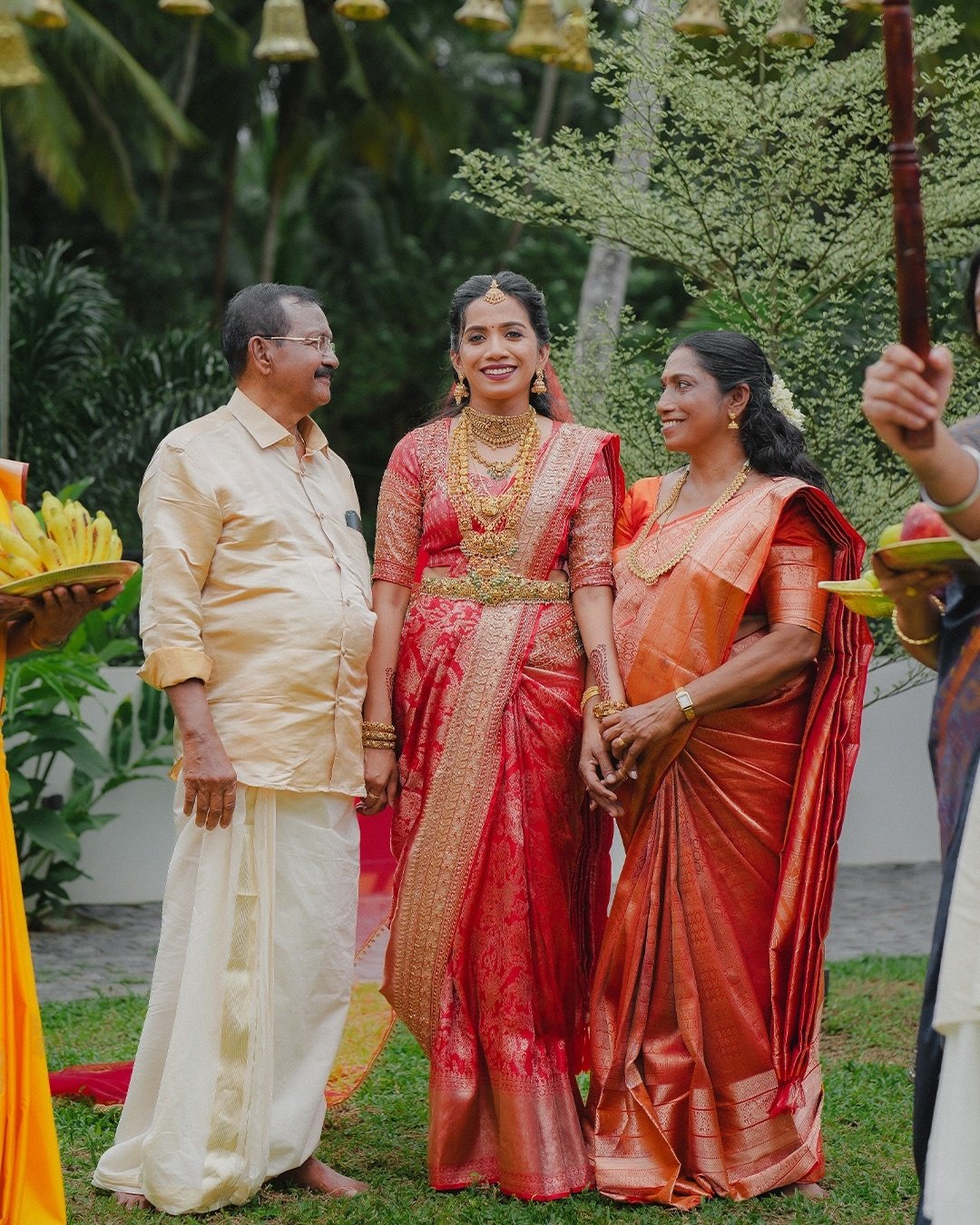 Bride smiling as the groom leans close